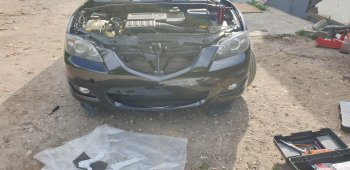 6 999 р. Передний бампер TYG (без отверстий под омыватели, 1.6L/2.0L) Mazda 3/Axela BK дорестайлинг седан (2003-2006) (Неокрашенный)  с доставкой в г. Керчь. Увеличить фотографию 2