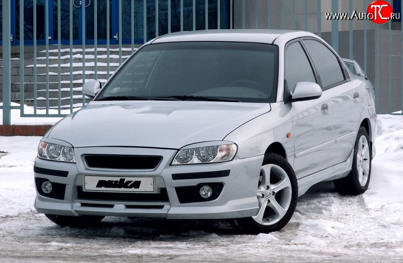 7 699 р. Передний бампер Nika Sport KIA Spectra (2000-2009) (Без вставок под ПТФ, Неокрашенный)  с доставкой в г. Керчь