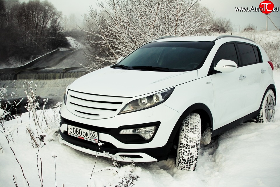 5 399 р. Накладка на передний бампер Ixion Style  KIA Sportage  3 SL (2010-2014) дорестайлинг (Неокрашенная)  с доставкой в г. Керчь