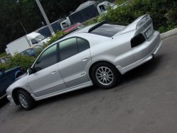 2 899 р. Козырёк на заднее стекло LIBERAL Mitsubishi Galant 8  дорестайлинг седан (1996-1998) (Неокрашенный)  с доставкой в г. Керчь. Увеличить фотографию 2