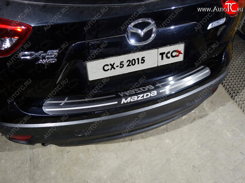 3 999 р. Накладка на задний бампер, ТСС Тюнинг  Mazda CX-5  KE (2015-2017) рестайлинг (лист шлифованный надпись MAZDA)  с доставкой в г. Керчь