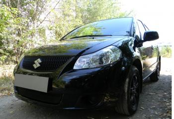 2 899 р. Защита радиатора Стрелка11 Стандарт Suzuki SX4 GYC21S дорестайлинг седан (2006-2012) (черная)  с доставкой в г. Керчь. Увеличить фотографию 2