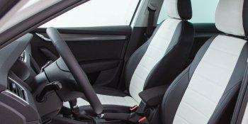 6 999 р. Чехлы Seintex (экокожа, 40/60, Airbag)  Лада Веста ( 2180,  SW 2181) - Веста Кросс ( 2181,  2180) (черный/белый)  с доставкой в г. Керчь. Увеличить фотографию 2